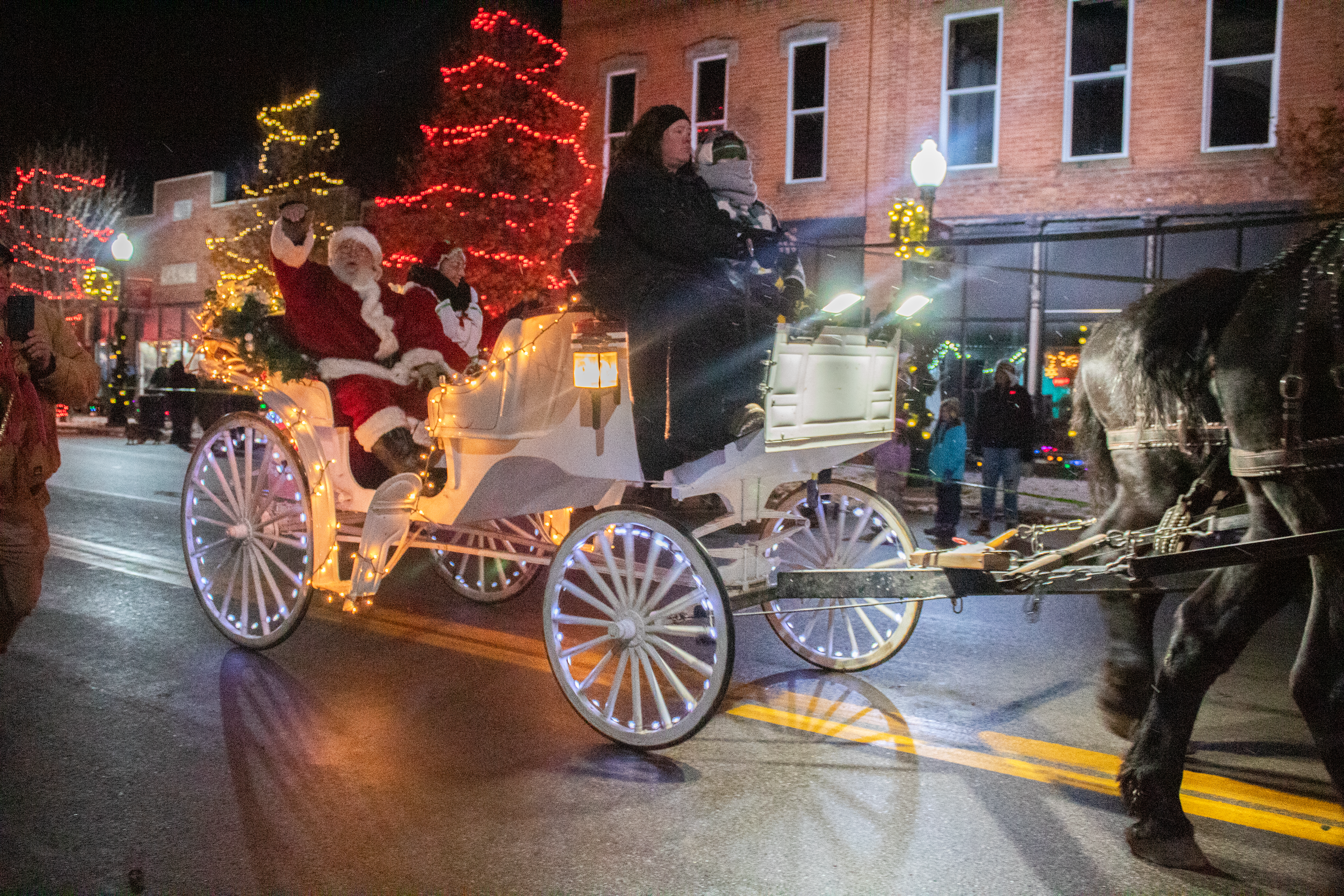 Snow and frigid temperatures didn’t dissuade local residents from attending the annual Festival of Lights parade on Nov. 30